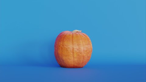 Single isolated orange pumpkin on a blue background. Dolly out. Photorealistic 3d animation.