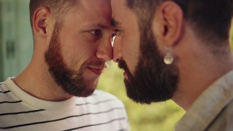 Authentic Close Up Footage of a Stylish Handsome Young Adult Gay Couple Spend Time at Home. Two Happy Men in Love in Casual Clothes Make a Gentle Nose Rub. Cute LGBTQ Relationship Content.
