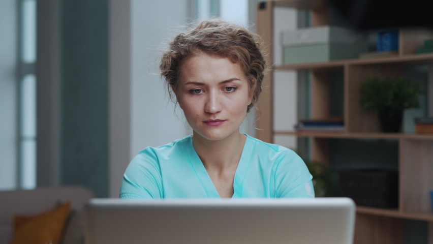 Professional Female Medical Doctor Working at Desk in Medical Office on Laptop Close up. Healthcare Concept. Beautiful Woman Focused Work Using Computer at Modern Room. Confident Professional Worker | Shutterstock HD Video #1083306304