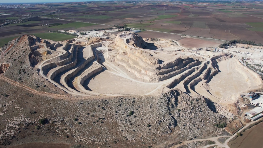 Aerial view of open pit mining of limestone materials for construction ...