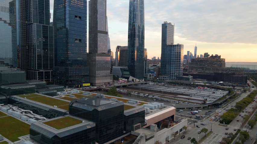 Aerial view of the West Side Yard in Midtown Manhattan, NYC - rising, drone shot Royalty-Free Stock Footage #1083318832