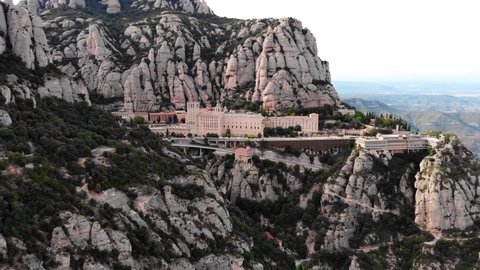 Drone shot of Mount Montserrat. Drone view of the famous Montserrat monastery.
Mountain shelter of Benedictine monks. The jagged mountains of Spain. Mountain landscape. Mountain trails.