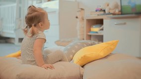 Little Girl Watching Television. Appropriate Content For Kids. Early Age Education. Happy Cute Little Kid Watching Cartoon. Little Girl Sitting On Bed Watching Television. Child On Happy Time Cartoon