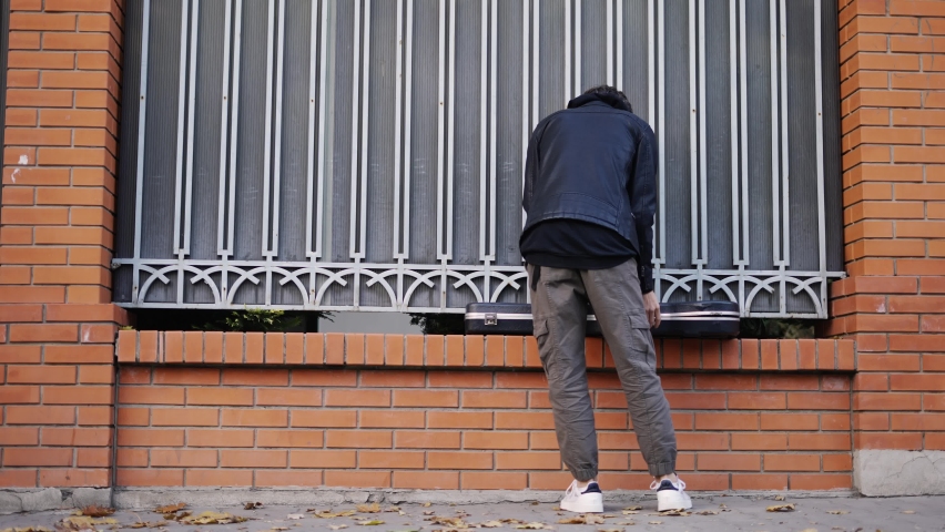 Guy takes out his guitar and starts playing