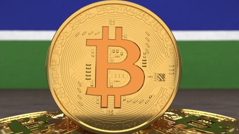 Bitcoin cryptocurrency on the background of the flag of Gambia. The concept of investing in cryptocurrency, blockchain technologies.