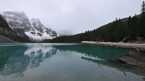 Scenery of Moraine lake in snowfall with Canadian rockies on gloomy at Banff national park, Canada