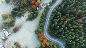 Aerial photo of beautiful mountain Krivopol pass Carpathians, Ukraine. Drone filmed an alpine landscape with coniferous and beech forests, houses, around a winding serpentine road, copter aerial video