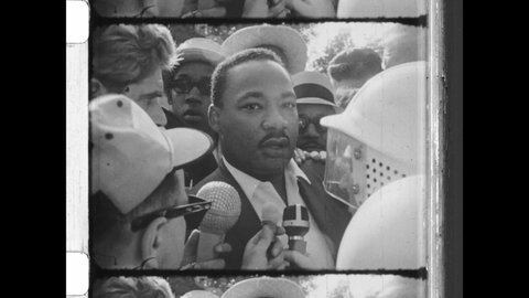 August 5th, 1966. Chicago, IL. Dr. Martin Luther King, Jr talks to Reporters about being hit in the head with a Rock during Nonviolent Protest during Chicago Freedom Movement. 4K Overscan of Newsreel 