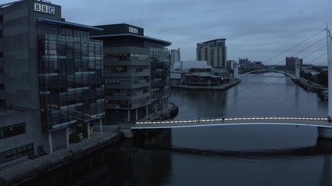 Manchester, UK. October 10, 2021. Aerial view of the Media City UK is on the banks of the Manchester Ship Canal in Salford and Trafford, Greater Manchester, England at dusk.