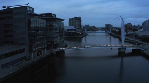 Manchester, UK. June 10, 2021. Aerial view of the Media City UK is on the banks of the Manchester Ship Canal in Salford and Trafford, Greater Manchester, England at dusk.