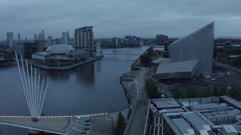 Manchester, UK. October 10, 2021. Aerial view of the Media City UK is on the banks of the Manchester Ship Canal in Salford and Trafford, Greater Manchester, England at dusk.
