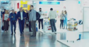 blurred defocused video. unrecognizable people in the lobby of a large modern building. business background.
