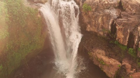 Amazing waterfall hidden in tropical rainforest. Beautiful nature background. 4K