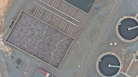 Aerial top view of sewage water treatment plant facilities recirculation sedimentation tank
