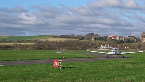Shoreham, West Sussex, UK, November 16, 2021. Piper PA 28 Cherokee Warrior II G-BSZT arriving at Brighton City Airport with Lancing College and the South Downs in the background.