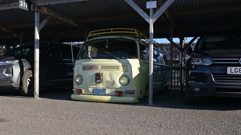 Goodwood, West Sussex, UK, December 01, 2021. Volkswagen Camper Van with extreme lowered suspension and a California plate number 227 DGM parked at Goodwood Aerodrome.