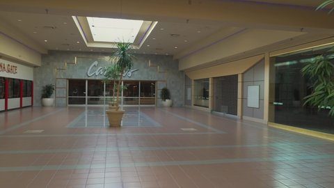 Indianapolis, IN USA - November 7 2021: This panning video features an empty, shutdown and deserted retail shopping mall.