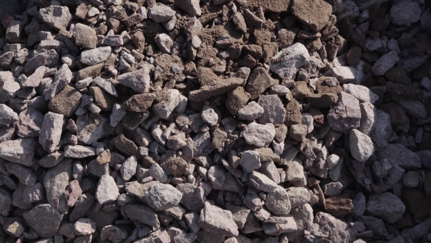 Building crushed stone close-up is thrown on a pile. High quality 4k footage