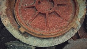 Many rusty sewer manhole cover lids on the ground after the renovation works, debris - Powered by Shutterstock - Get 15% off with code: PIKWIZARD15