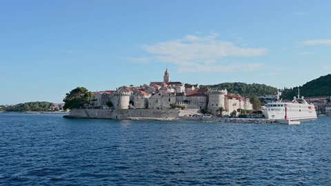 Historic town of Korcula, Croatia. Stone walls, towers, houses and buildings in old town. Adriatic sea and island of Korcula. 