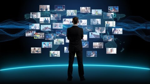 Businessman is standing in front of multi screen. Collage made of many different footages with business people working in office or outdoor. Technology, investment and teamwork concept.