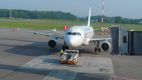 KALININGRAD, RUSSIA - JULY 28, 2021: Airbus A321 Ural Airlines taxis from terminal to departure runway at Khraborovo Airport, Kaliningrad (KGD). Passenger boarding is over. Departing flight on a