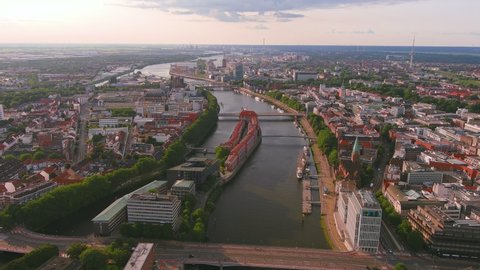 Bremen: Aerial view of city in Germany and capital of Free Hanseatic City of Bremen (Freie Hansestadt Bremen) in summer, river Weser - landscape panorama of Europe from above

