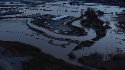 Aerial view of Fraser Valley farmers fields flooded from torrential rains, climate change effect, natural disaster, intense flooding, British Columbia. 4K 