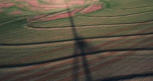 Shadow of a moving wind turbine recorded with drone.