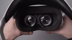 First-person view, a man puts on virtual reality glasses. Putting on VR glasses Virtual Reality