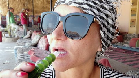 Woman Smoking Shisha At visit of Bedouine village in Egypt