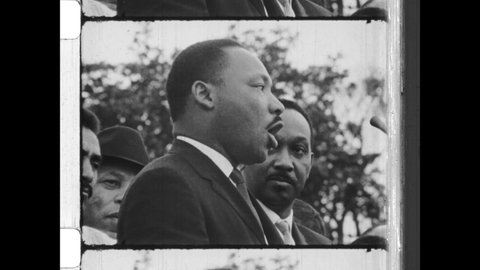 March 25, 1965. Montgomery, AL. ON the steps of the  State Capitol, Dr Martin Luther King Jr. delivers the speech 'Our God is Marching On!', aka 'How Long, Not Long' Speech. 4K Overscan of Newsreel