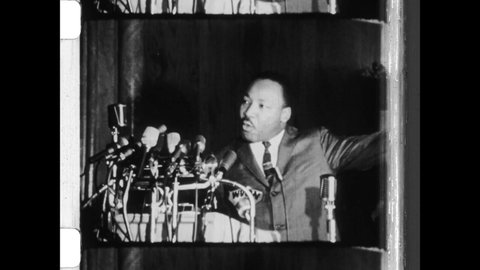 1966 Chicago, IL. Dr. Martin Luther King, Jr speaking at a podium, discusses Redlining and Civil Rights Testing, the investigative tool used to gather evidence of discrimination. 4K Overscan Newsreel