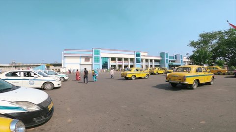 Yellow Ambassador cabs waiting  in a taxi stand outside Kolkata Railway Station. Chitpur, West Bengal, India, Asia Pacific. November 30, 2021 