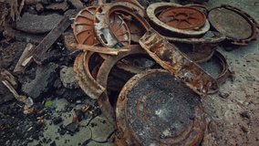 Manhole caps weathered and rusty are lying as construction debris on the street - Powered by Shutterstock - Get 15% off with code: PIKWIZARD15
