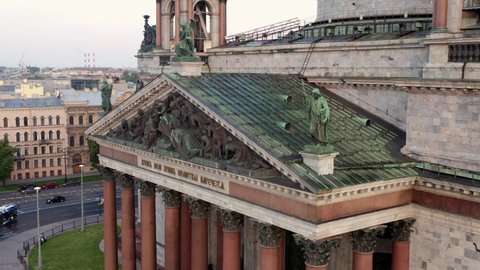 Russia, St. Petersburg, summer 2021: Aerial close up shot of sculptures on roof Isaac Cathedral church, summer early morning
