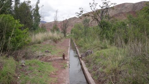 Video of water canal in Cusco Peru. Water infrastructure for agriculture.