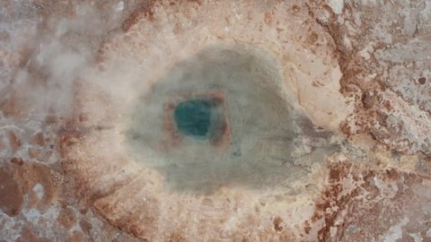 Overhead view of Strokkur geyser in Geysir area in Iceland. Top down view of steaming geyser in Golden circle geothermal area in icelandic countryside. Tourist attraction. Amazing on earth