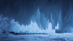 Grandiose icicles, sharp ice floes, narrow cave winter frozen grotto blue ice, icebergs of Lake Baikal. Amazing natural landscape landmark. Buryatia Russia miracle of nature. Dolly sideways motion - Powered by Shutterstock - Get 15% off with code: PIKWIZARD15