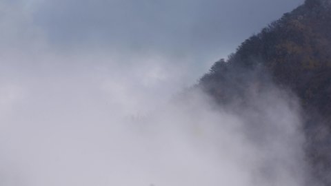 Volcanic mountain valley covered by sulphuric white smoke in Hakone, Japan