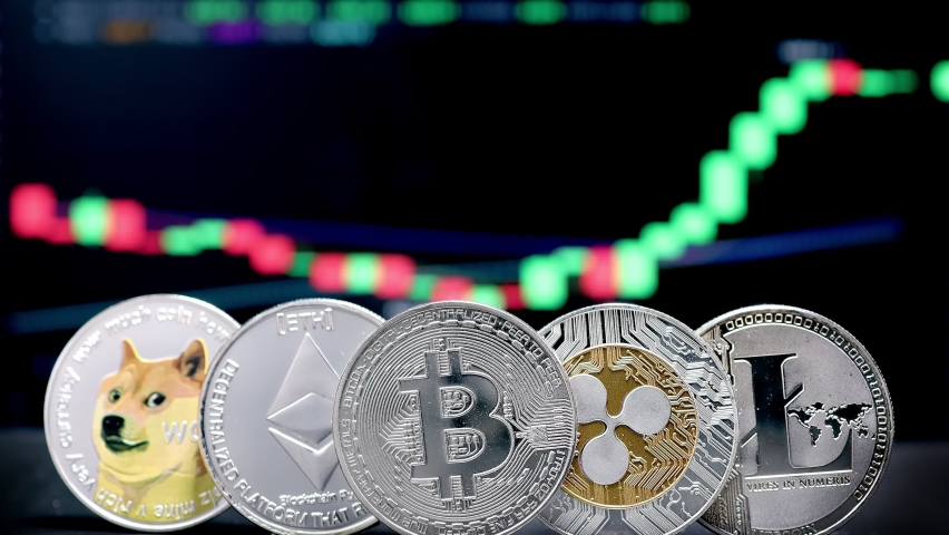 Coin Bitcoin, Ethereum, Litecoin, Shiba and Ripple on background cryptocurrency trading chart on computer screen. Digital money, banking, investment, finance and business concept. | Shutterstock HD Video #1083492001