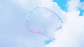 Big multicolored soap bubble on a background of blue sky and white clouds. rainbow colors on flying soap bubbles. holiday for happy children. magic, dreams. Liquid - Powered by Shutterstock - Get 15% off with code: PIKWIZARD15