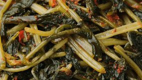 Korean fermented Young Radish leaves Kimchi. Rotating video