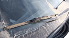 car wipers on a dirty windshield, the appearance of the car - Powered by Shutterstock - Get 15% off with code: PIKWIZARD15