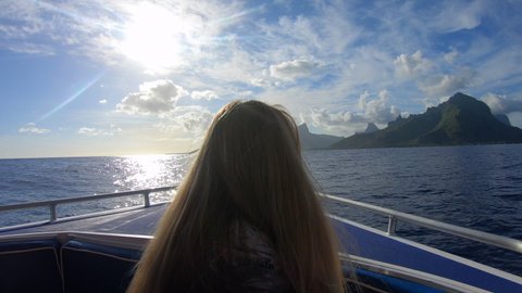 Female Tourist Riding In Nautical Vessel Over Sea During Vacation - Mo'orea, French Polynesia