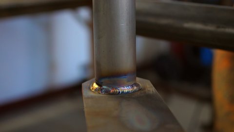 Lockdown Close-Up Shot Of Hot Welded Metal Rod Rotating At Workshop - Monterey, California