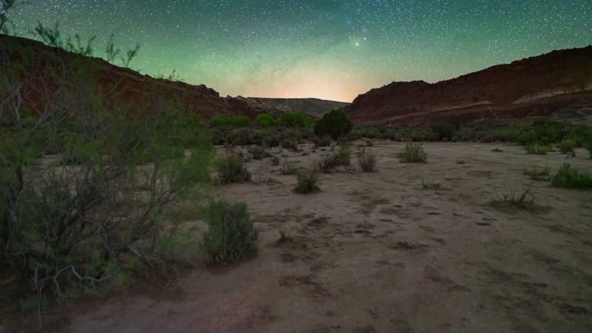 Time Lapse Shot Of Scenic Milky Way Over Desert At Night - Paria River, Arizona