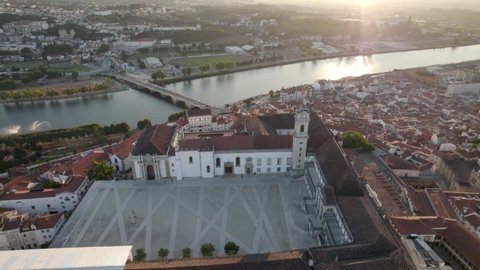 aerial top down view orbit over Coimbra university of law, Mondego river Backgound