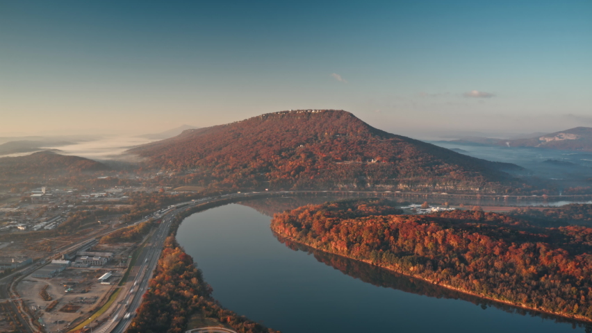 Aerial timelapse of Lookout Mountain and the Tennessee River with a barge.