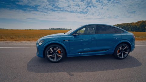 KYIV, UKRAINE - August 2021: Audi e tron profile view. Audi e tron, a fully electric car on highway